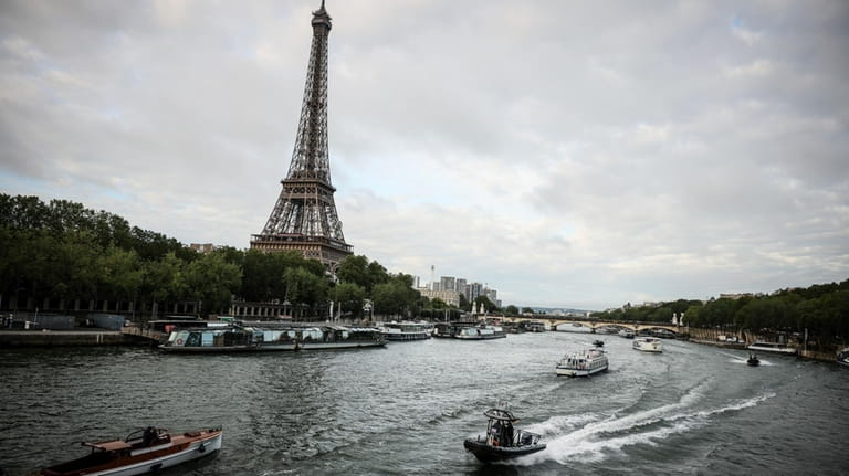 Barges cruise on the Seine river during a rehearsal for...