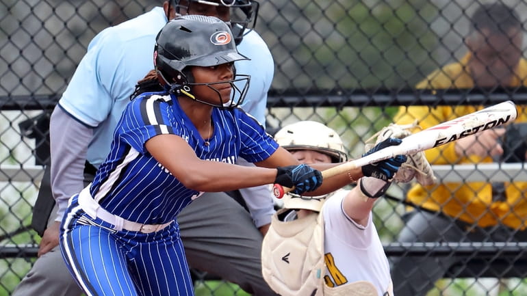 North Babylon's Aaliyah Lamarre bunts for a single against Commack...