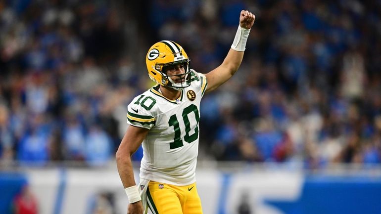 Green Bay Packers quarterback Jordan Love runs up field after...