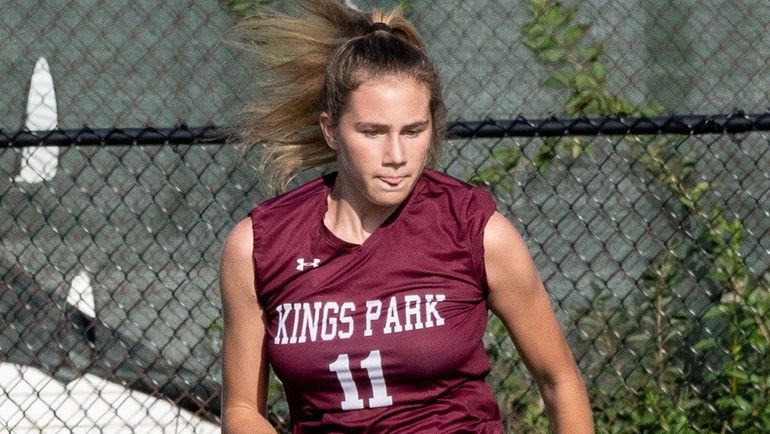 Kings Park's Tori Menzies holds ball from Hauppauge's Allie Kelly during...