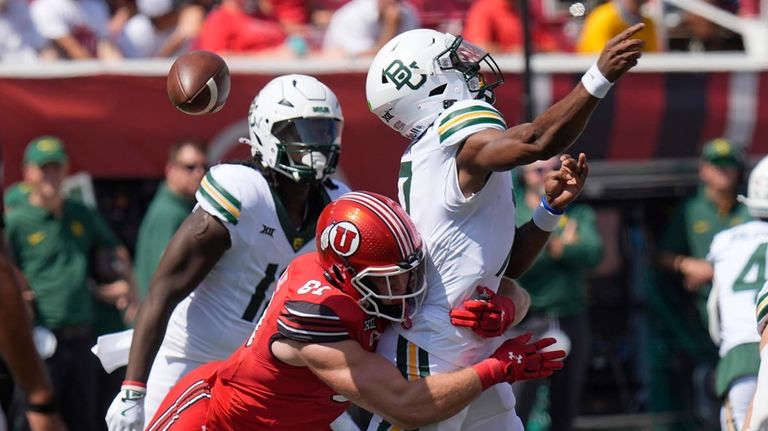 Baylor quarterback Dequan Finn (7) fumbles the ball after taking...