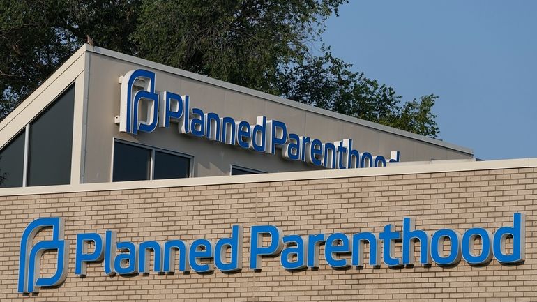 A Planned Parenthood sign is displayed on the outside of...