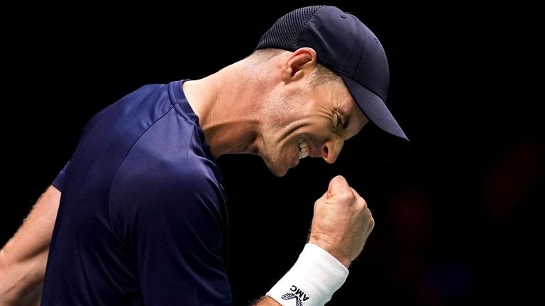 Britain's Andy Murray celebrates breaking serve in the third set...