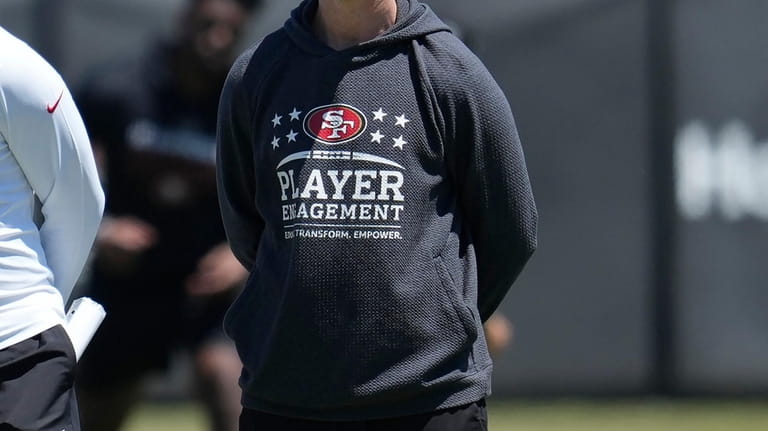 San Francisco 49ers defensive coordinator Nick Sorensen watches players run...