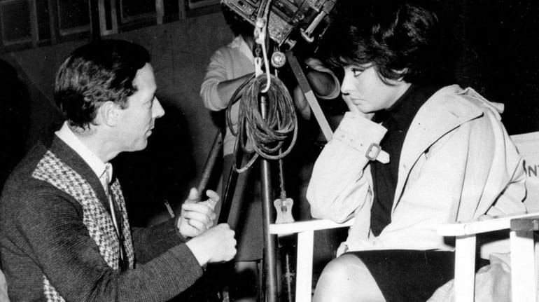 Director Michael Anderson talks with Sophia Loren on the set...