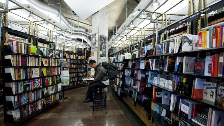 A customer shops for a book at the St. Mark's...