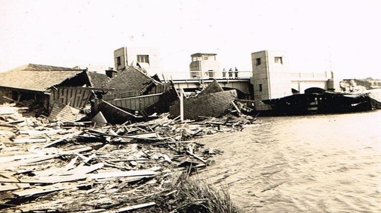 A Dune Road home washed onto Beach Lane bridge.