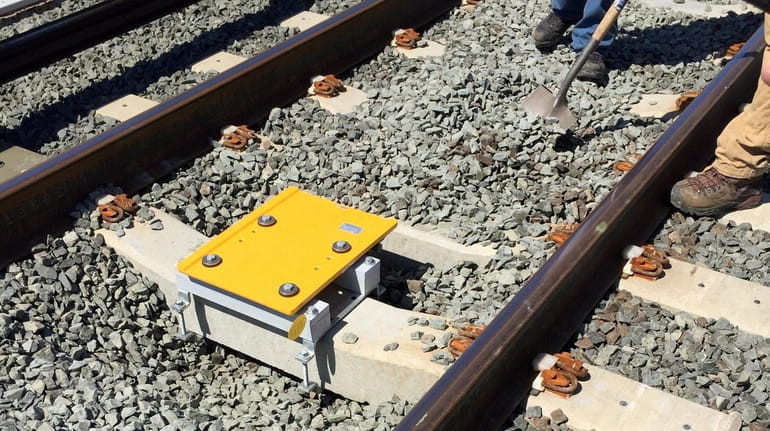 Transponders for use with the LIRR's PTC system are installed...