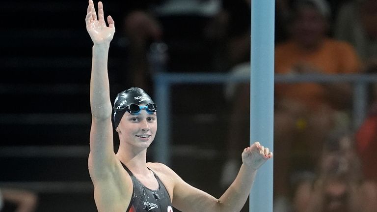 Summer McIntosh, of Canada, waves after winning the women's 200-meter...