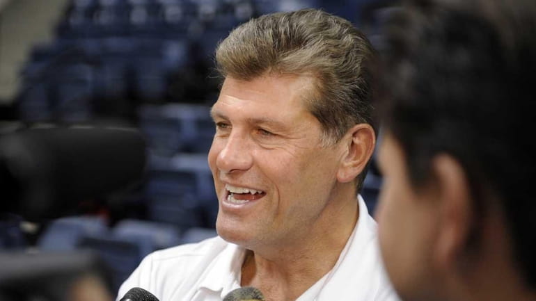 Connecticut women's basketball coach Geno Auriemma speaks with reporters during...