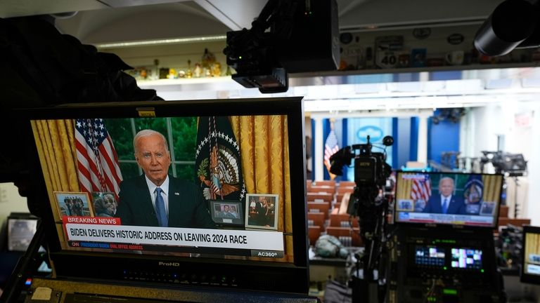 President Joe Biden is seen on a monitor in the...