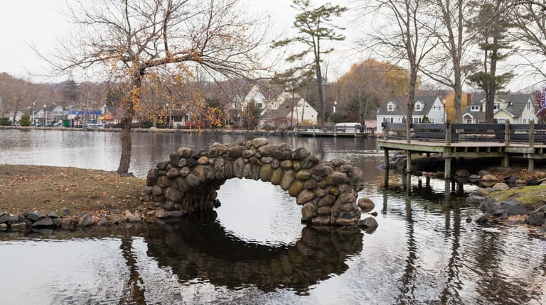 Heckscher Park is a community focal point, with its pond,...