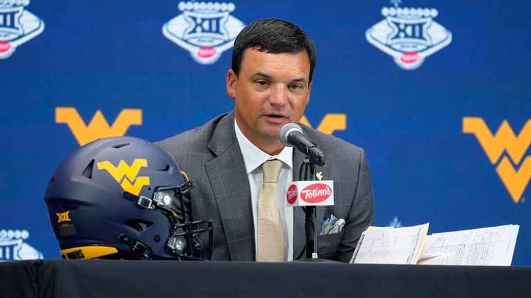 West Virginia head coach Neal Brown speaks during Big 12...