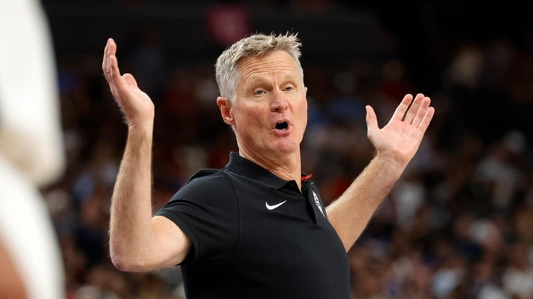 United States head coach Steve Kerr reacts to a play...