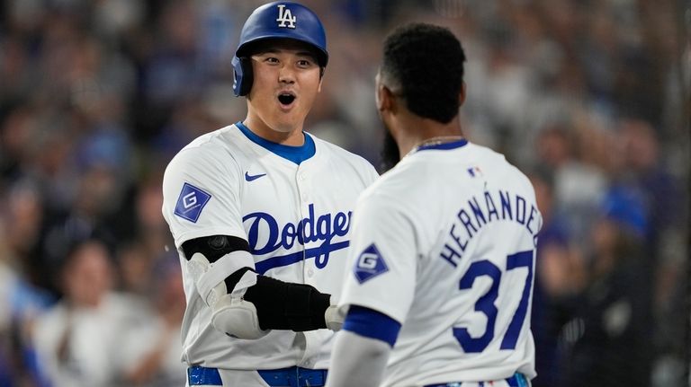 Los Angeles Dodgers designated hitter Shohei Ohtani (17) celebrates with...