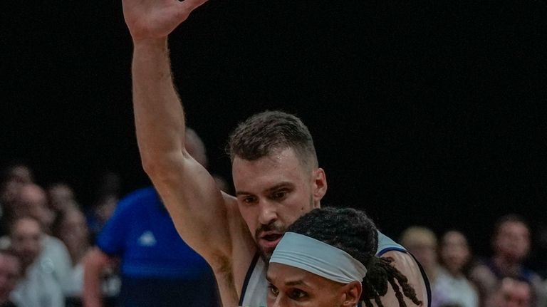 Australia's Patty Mills drives to the basket during an exhibition...