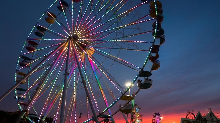 The giant Ferris wheel at the Empire State Fair at the...