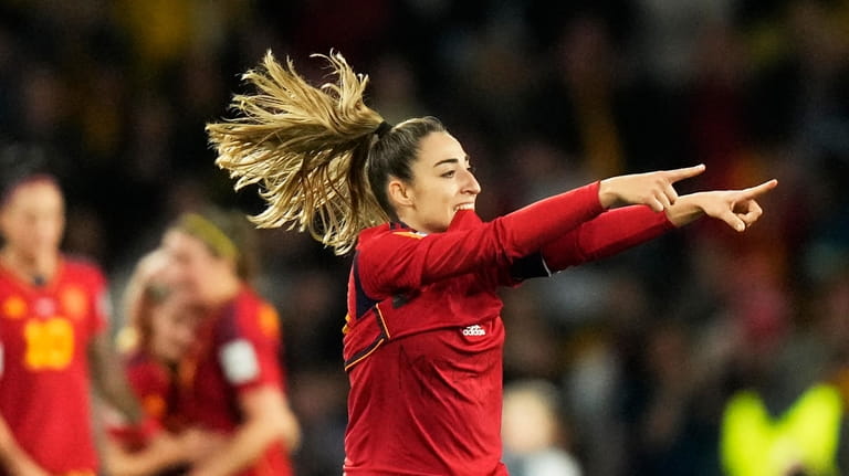 Spain's Olga Carmona celebrates after scoring the opening goal during...