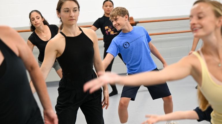 John Moger, 13, of Greenlawn, shows off his moves at...