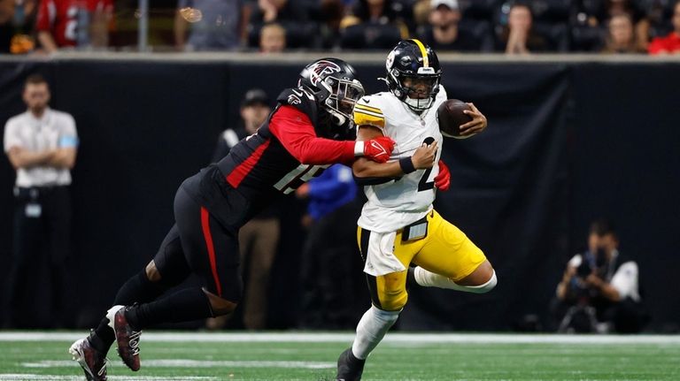 Pittsburgh Steelers quarterback Justin Fields (2) is stopped by Atlanta...