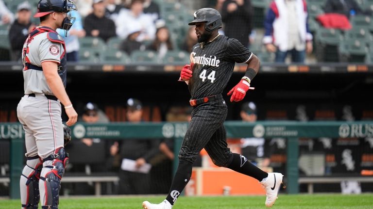 Chicago White Sox's Bryan Ramos scores on a sacrifice fly...