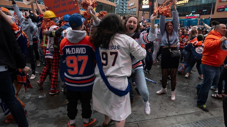 Edmonton Oilers fans celebrate the team's win over the Florida...