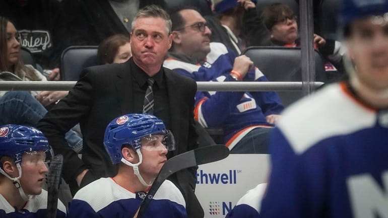 New York Islanders' head coach Patrick Roy, center, reacts, during...