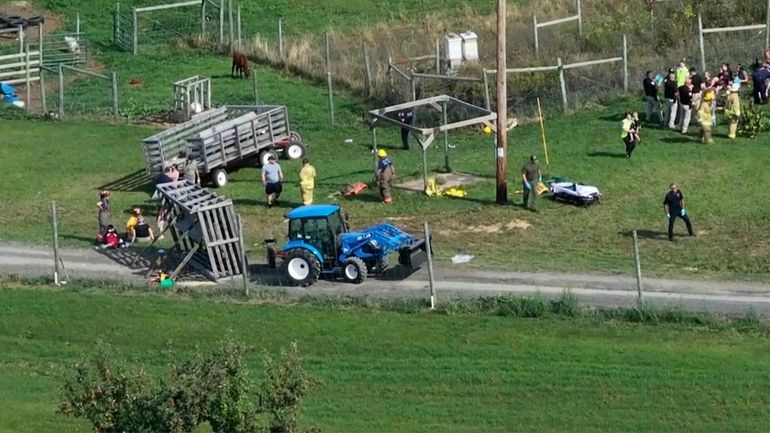 Emergency personnel respond to the scene where a wagon ride...