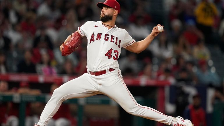 Los Angeles Angels starting pitcher Patrick Sandoval throws to the...