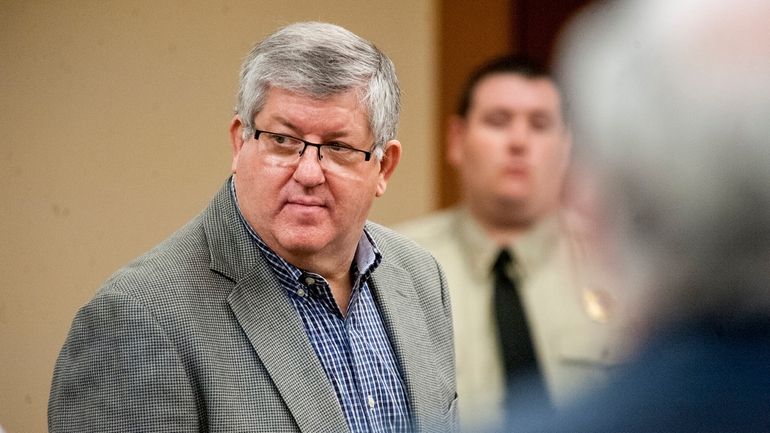 Bernie Tiede, left, stands in court during day nine of...