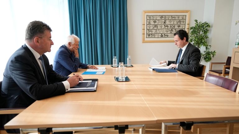 Kosovo's Prime Minister Albin Kurti, right, waits for the start...