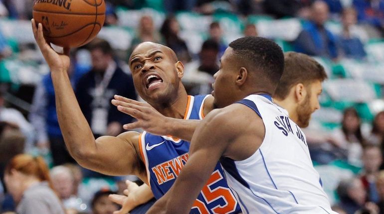 Knicks guard Jarrett Jack (55) battles Dallas Mavericks guard Dennis...