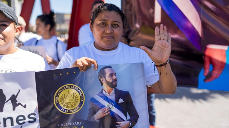 A supporter of El Salvador President Nayib Bukele, who is...