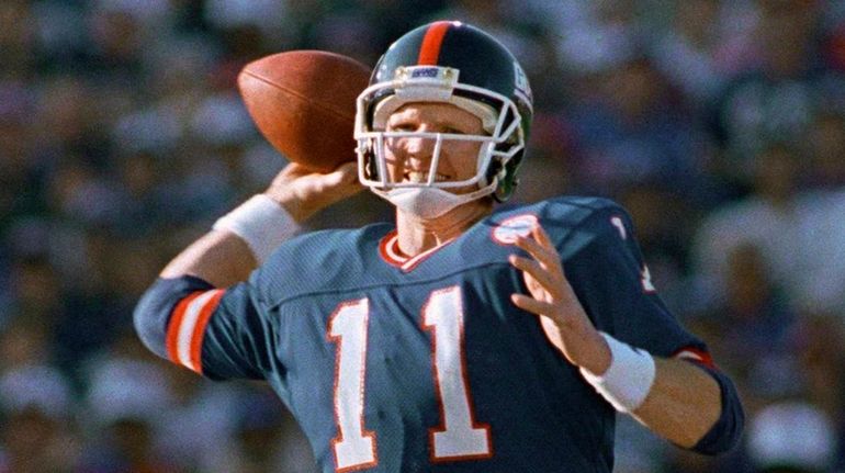 Giants quarterback Phil Simms winds up to pass during the...