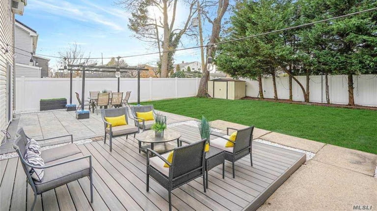 The updated backyard is well-suited to entertaining.