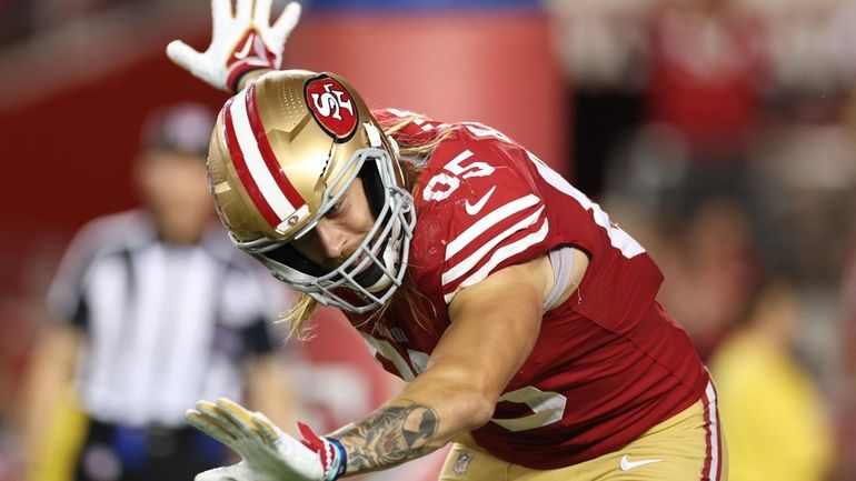 George Kittle of the San Francisco 49ers celebrates after a...