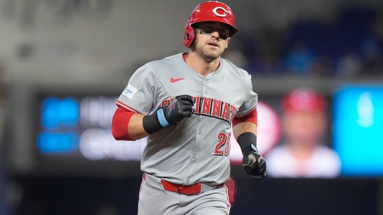 Cincinnati Reds' TJ Friedl (29) runs the bases after hitting...