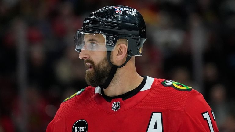 Chicago Blackhawks left wing Nick Foligno reacts after a penalty...