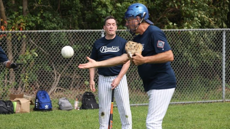 From left, Jimmy Hughes and pitcher James Sciortino.