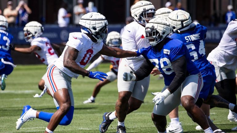 New York Giants linebacker Brian Burns (0) goes against offensive...