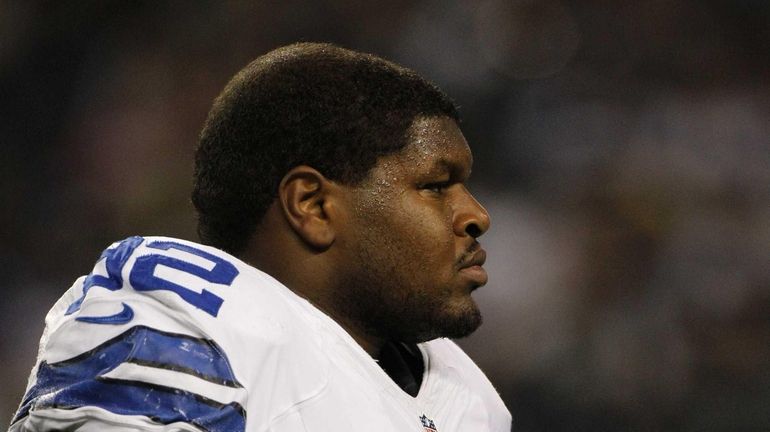 Dallas Cowboys nose tackle Josh Brent looks on during warm...