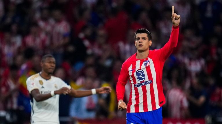 Atletico Madrid's Alvaro Morata celebrates after scoring his side's third...