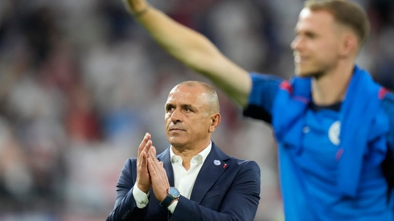 Slovakia's head coach Francesco Calzona applaud supporters at the end...