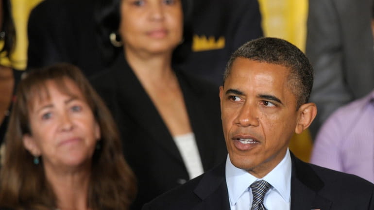 President Barack Obama calls on Congress to pass a temporary,...