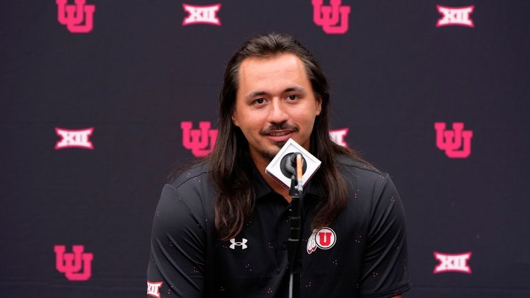 Utah quarterback Cameron Rising answers questions from the media during...