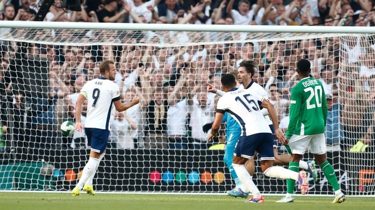 England's Jack Grealish, second right celebrates after scoring his side...