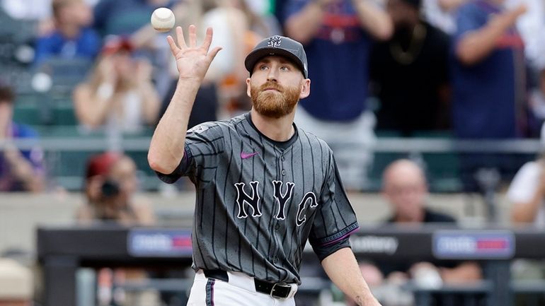 Reed Garrett of the Mets reacts during the eighth inning...