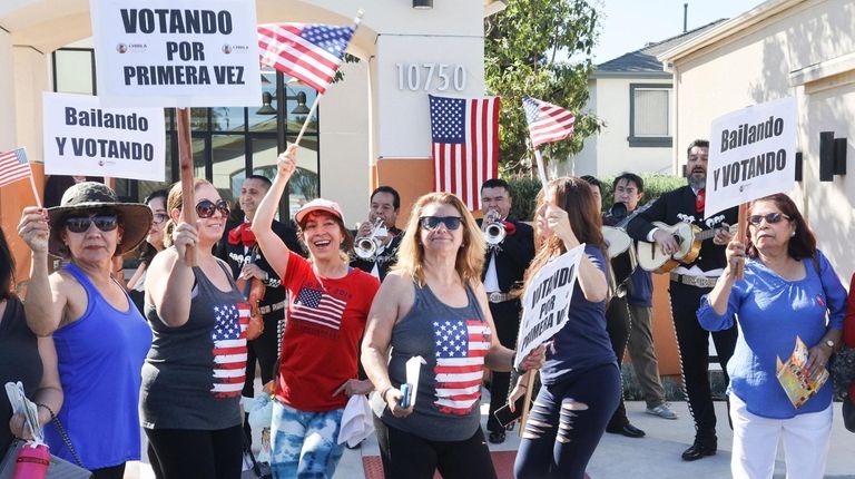 First-time immigrant voters outside a polling place during the California...