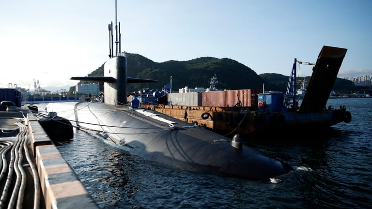 The USS Kentucky, a U.S. nuclear-armed submarine, is anchored at...