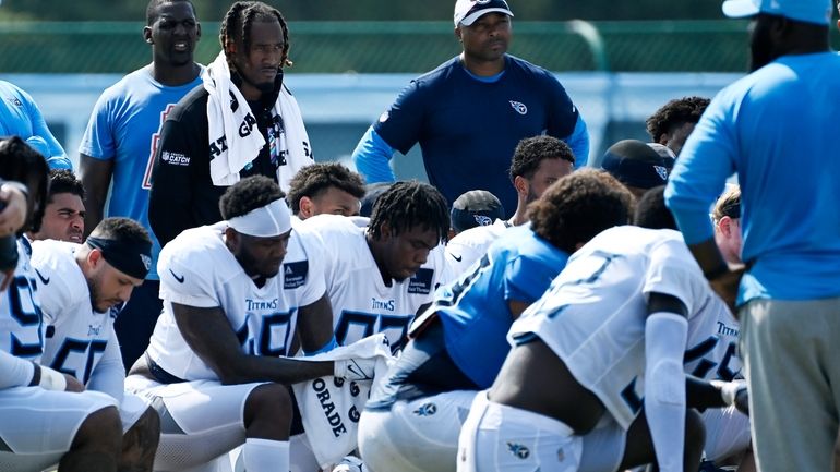 Tennessee Titans cornerback L'Jarius Sneed, top, second from left, listens...